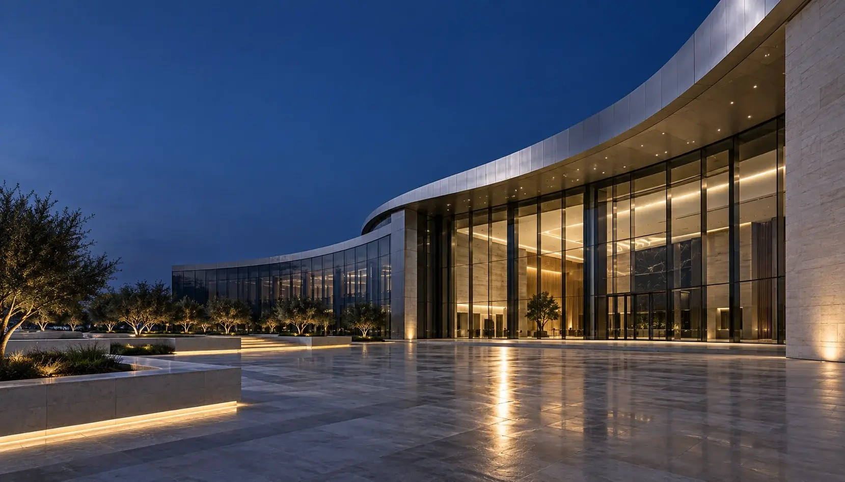 Architectural concept of a contemporary glass and metal building at blue hour